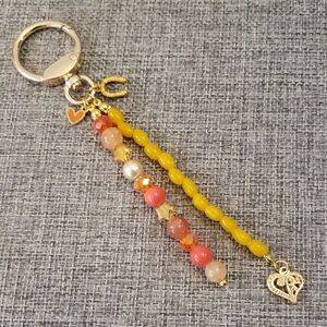 Vibrant Yellow Orange Beaded Bag Charm with Heart Charm